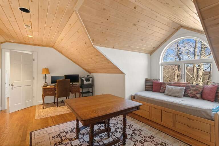 The Loft Has a Window Set, Table and Dedicated Work Space