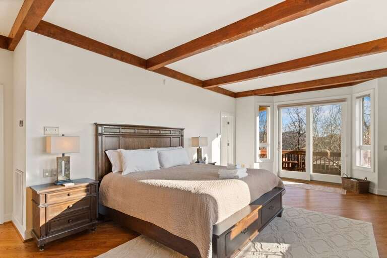 The Luxurious Master King Suite Boasts 'His' and 'Hers' Bathrooms and a Private Deck leading to the Hot Tub Deck