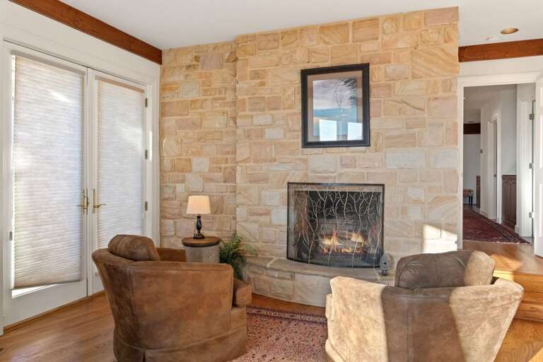 Sitting Area with Gas Fireplace and HDTV in the Master Suite