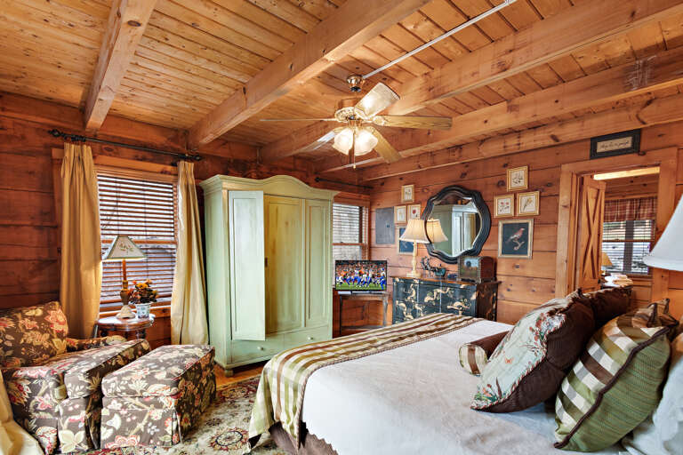 Lower Level Master Bedroom Includes Private Bathroom, Desk, Rocking Chair, and TV