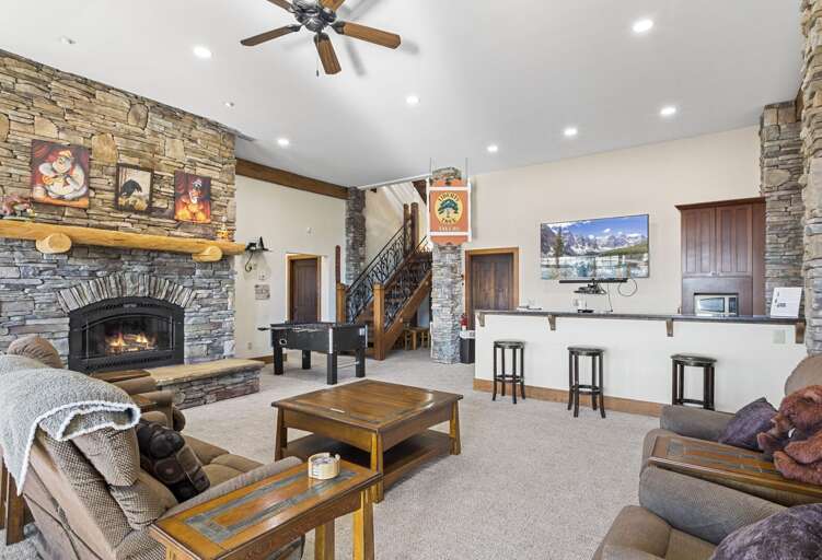 A Large Wet Bar includes Bar Stools and a Mini Fridge A Large Wet Bar includes Bar Stools and a Mini Fridge