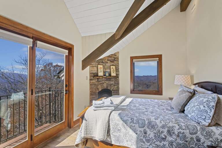 Upper Level Full Bedroom with Gas Fireplace and Private Balcony Upper Level Full Bedroom with Gas Fireplace and Private Balcony