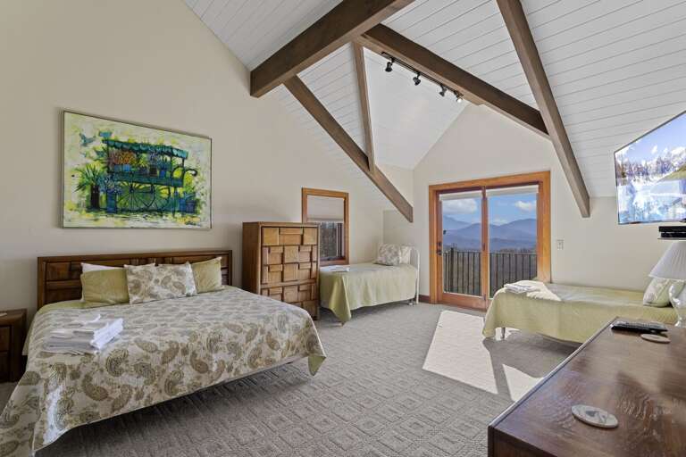 Upstairs King Bedroom with Two Twin Beds and Private Balcony Upstairs King Bedroom with Two Twin Beds and Private Balcony