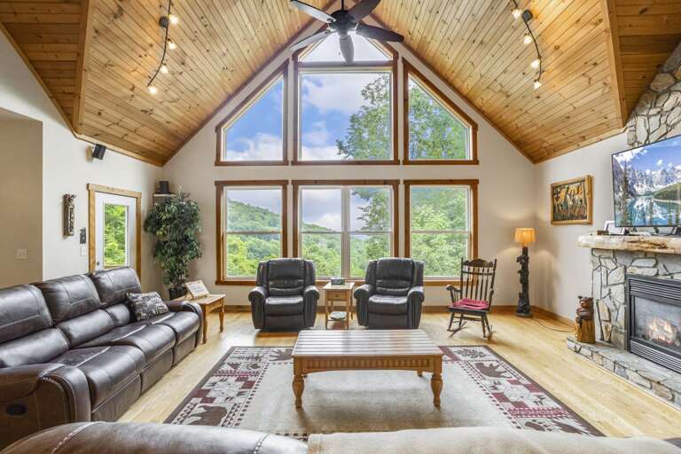 Wildlife Manor Living Room with Gas Stove Fireplace, Flat Screen TV with Surround Sound, Views and Luxury Leather Furniture.