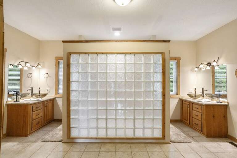 Wildlife Manor Master Bathroom with Double Vanities, Tiled Shower with Dual Shower Heads, and Large Closets on both sides of Bathroom that can Serve as Bonus Room with Pack 'n Play