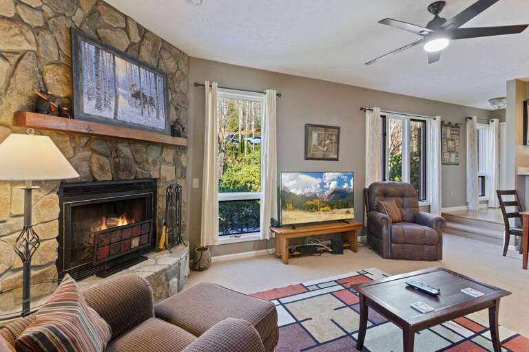 Stacked Stone Gas Fireplace and Big Screen TV in the Living Room
