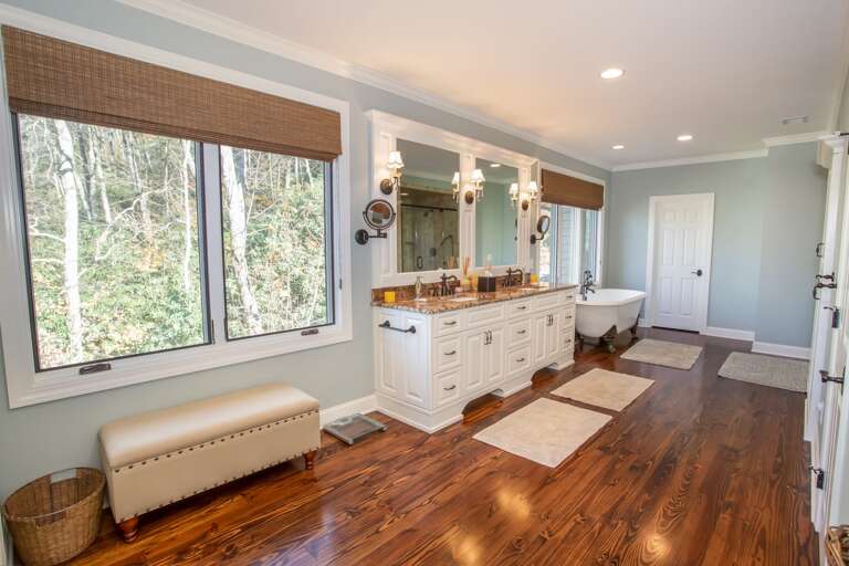 Spacious Bathroom with Double Vanity, Tub, and Walk in Shower