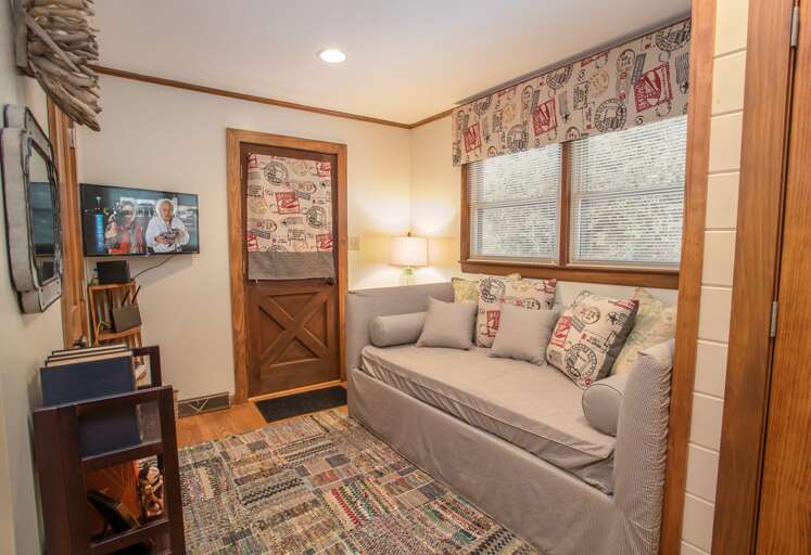 Sitting Room with Side Entrance from Parking Area and Grill Porch, Twin Daybed and HD Smart TV