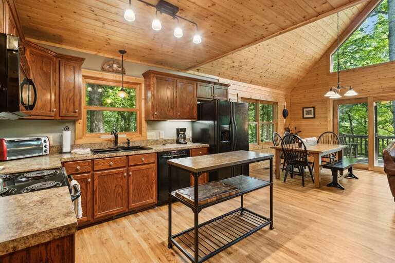Kitchen and Dining Area Open to the Living Room and Deck