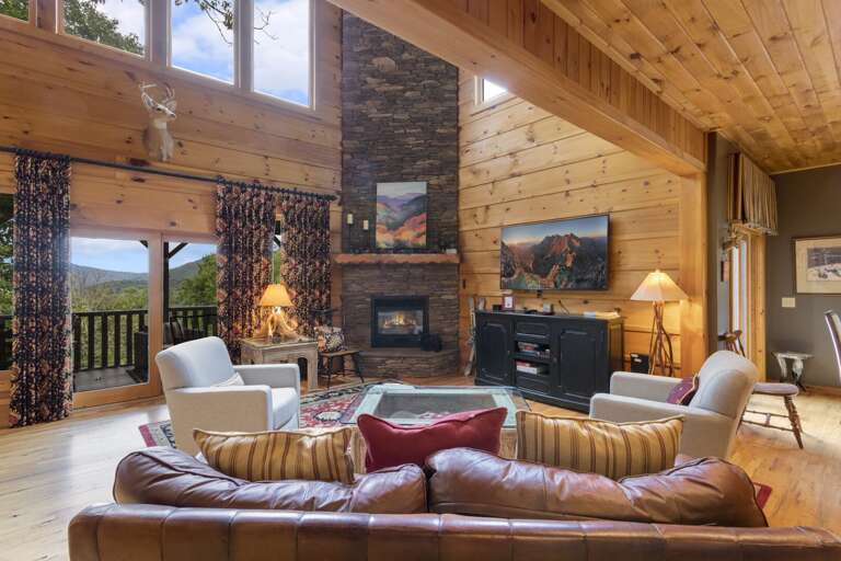 Great Room with Leather Furniture and Stone Gas Log Fireplace