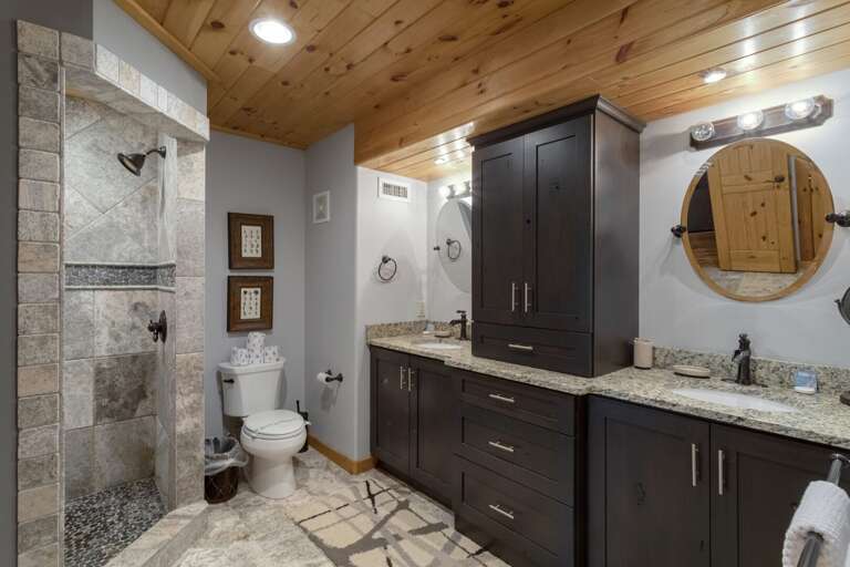 Lower Level Full Bathroom with Granite Vanity and Tile Shower