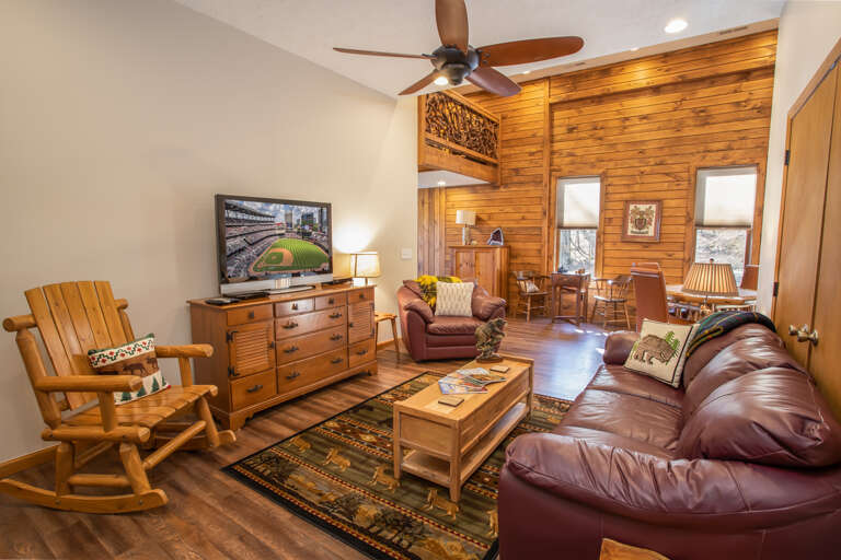 Lower Level Den with Leather Furniture, Huge HD Smart TV, Checkers and Chess Table, and Four-Seat Table and Chairs Lower Level Den with Leather Furniture, Huge HD Smart TV, Checkers and Chess Table, and Four-Seat Table and Chairs