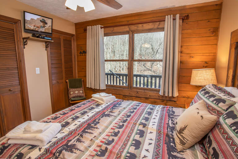 Main Level Queen Bedroom with HDTV Main Level Queen Bedroom with HDTV
