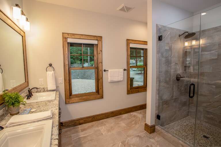 Private Ensuite Master Bathroom has Large Tile Shower with Frameless Glass Door