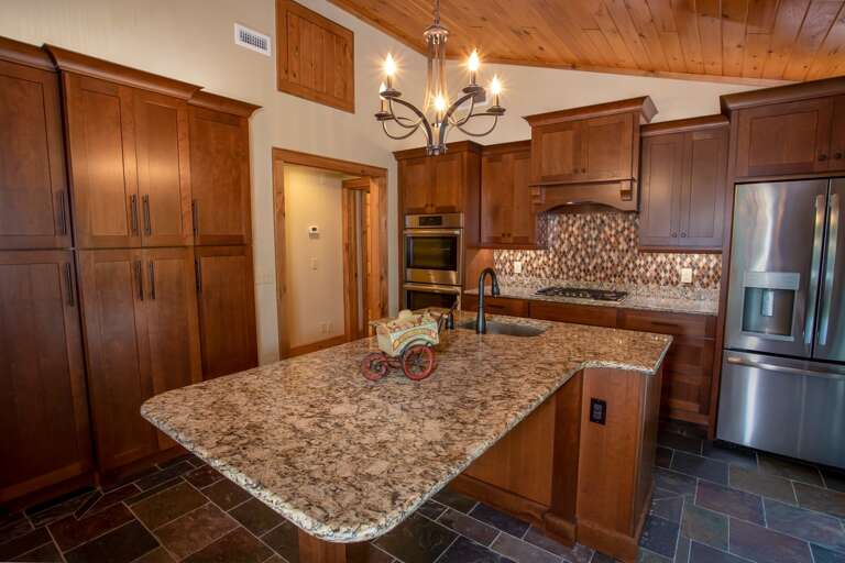 Central Granite Island has Bar Stool Seating and Second Sink Central Granite Island has Bar Stool Seating and Second Sink