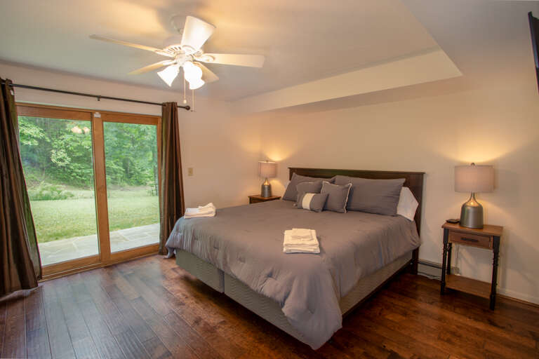 Lower Level King Bedroom with Sliding Glass Door to Yard Lower Level King Bedroom with Sliding Glass Door to Yard
