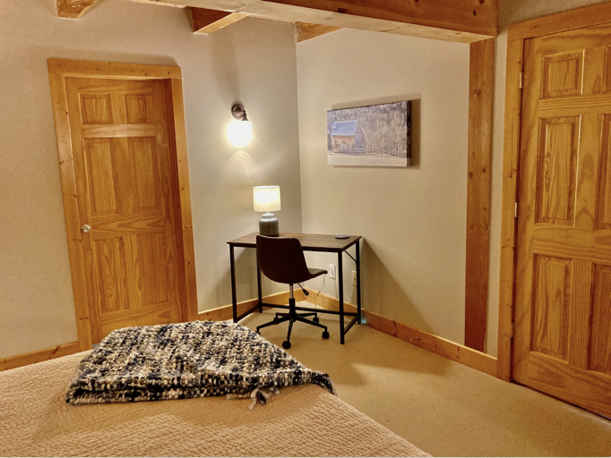 Convenient work space in master BR! The lodge's excellent internet and wifi makes it easy to work or attend school remotely.