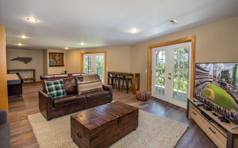 Leather Sofa in Lower Level Den also opens to boast a Queen Sleeper!