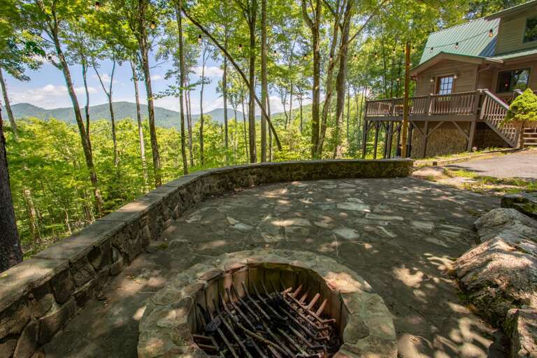 Stone Courtyard with Wood Burning Fire Pit, *Plastic Adirondack Seating Not Pictured*