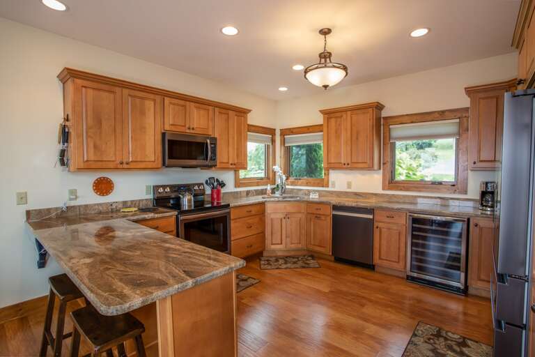 Big Kitchen with wood floors and New Brushed Nickel High-end Appliances!