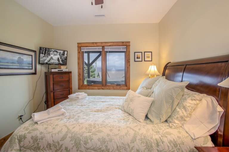 Lower Level Queen Bedroom with View Window and HDTV