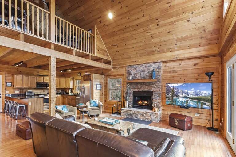 Great Room open to Kitchen and Dining, as well as to Loft above