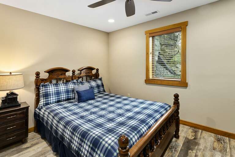 Lower Level Queen Bedroom with Ceiling Fan and TV