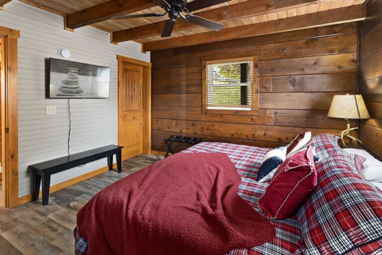 Master Bedroom on Main Level with TV and Ceiling Fan