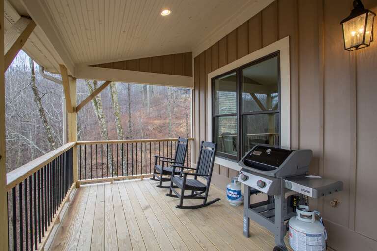 Additional Rocking Chairs and a Gas Grill on the Deck