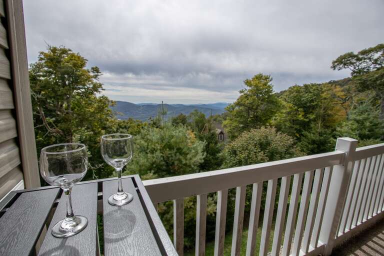 Bear Necessities' Top-Level Covered Deck with Layered, Long-Range Mountain Views