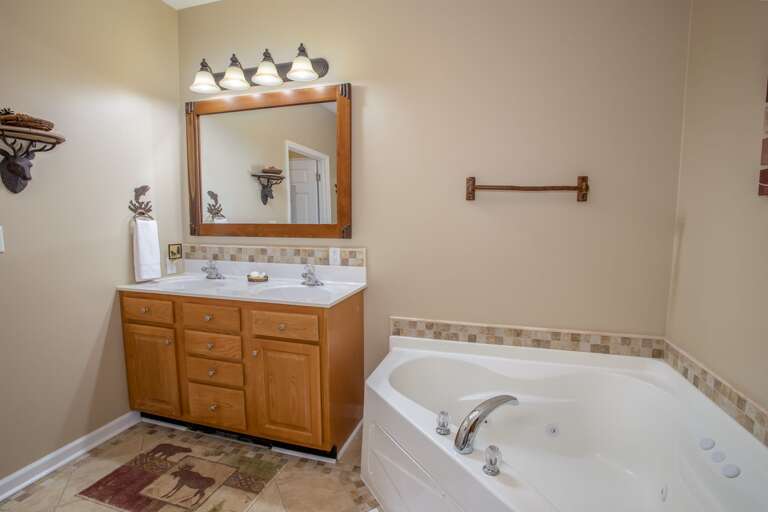 Oversized Comfy Corner Jetted Soaking Tub in Master Bathroom