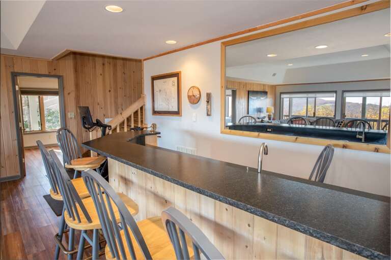 Extra Long Bar in Lower Level Family Room with Mini Fridge, Barstool Seating for Six