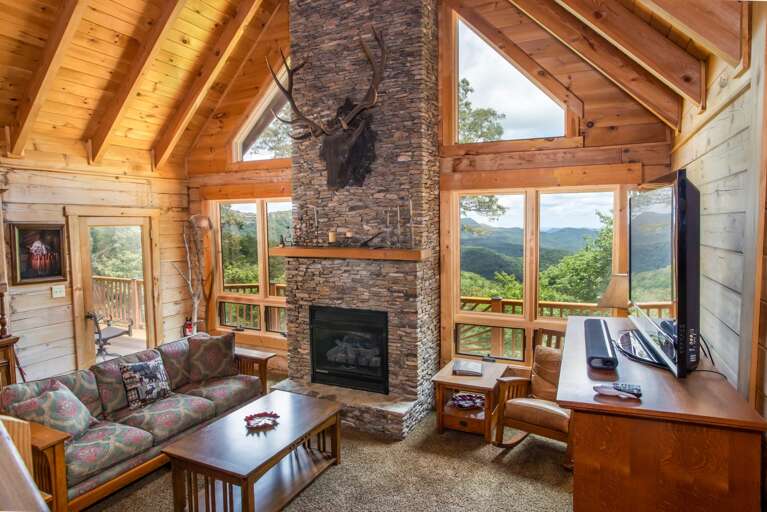 Living Room with Vaulted Ceiling and Stone Fireplace Living Room with Vaulted Ceiling and Stone Fireplace