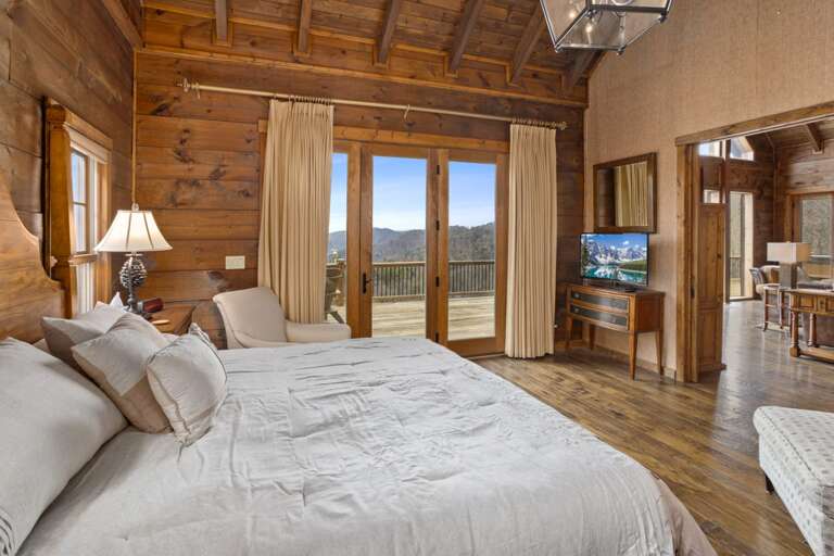 King Bedroom on Main Level with TV and access to Deck