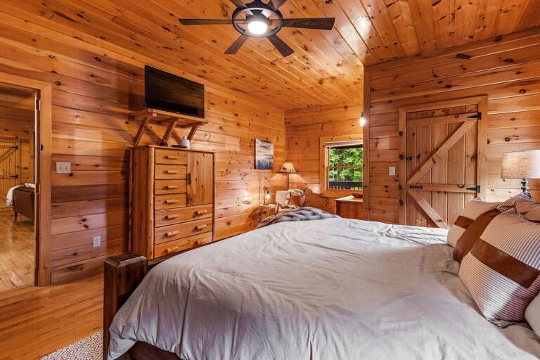TV and Ceiling Fan in the Master Suite with Private Bathroom
