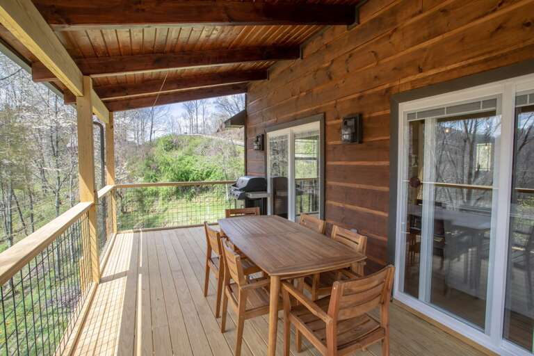 Covered Deck on the Main Level with Dining for 6 Covered Deck on the Main Level with Dining for 6