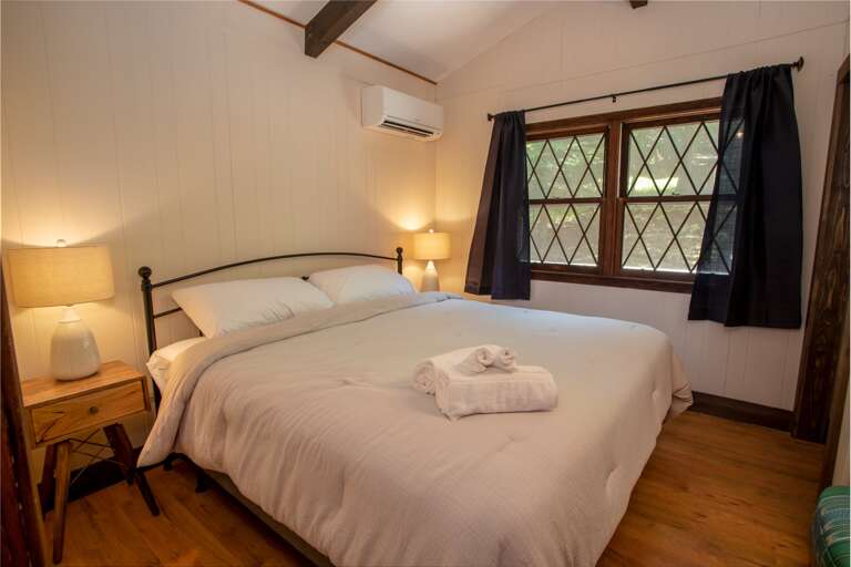 Second King Bed with Flanking Bedside Tables and Lamps.