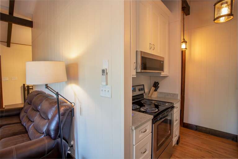 Kitchen with Oven and Stovetop, open to Great Room and Dining Area