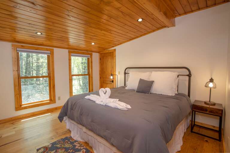 Second Upstairs King Bedroom with Huge Windows that overlook the Creeks and Streams