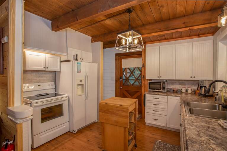 Double Sink and Flat Surface Cooktop in Kitchen
