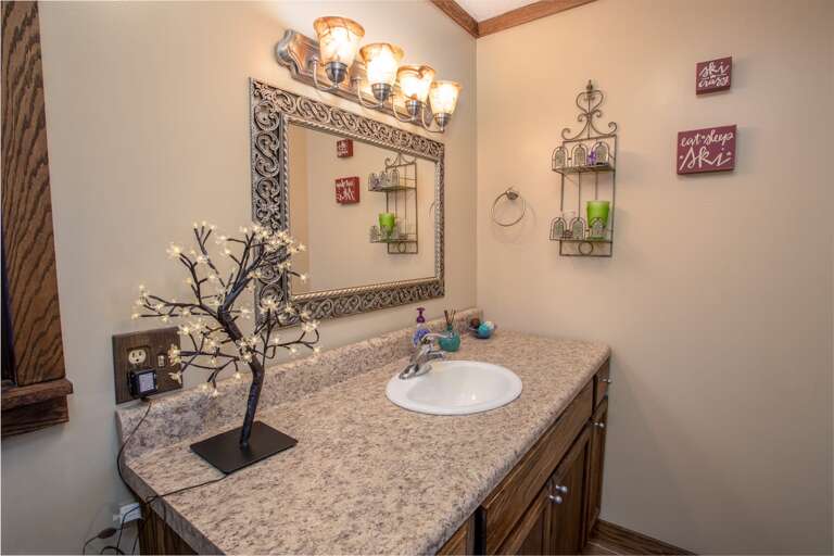 Generous Vanity and Sink in Full Bathroom