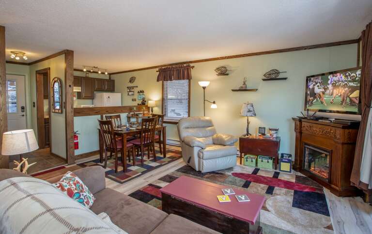 See the HD Smart TV from Kitchen, as well as Sleeping, Living, and Dining areas!