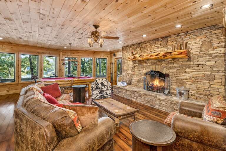 Downstairs Den with Wood Burning Fireplace, TV and Game Tables