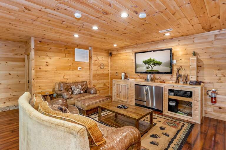 Downstairs Entertainment Area with Ice Maker and Refrigerator