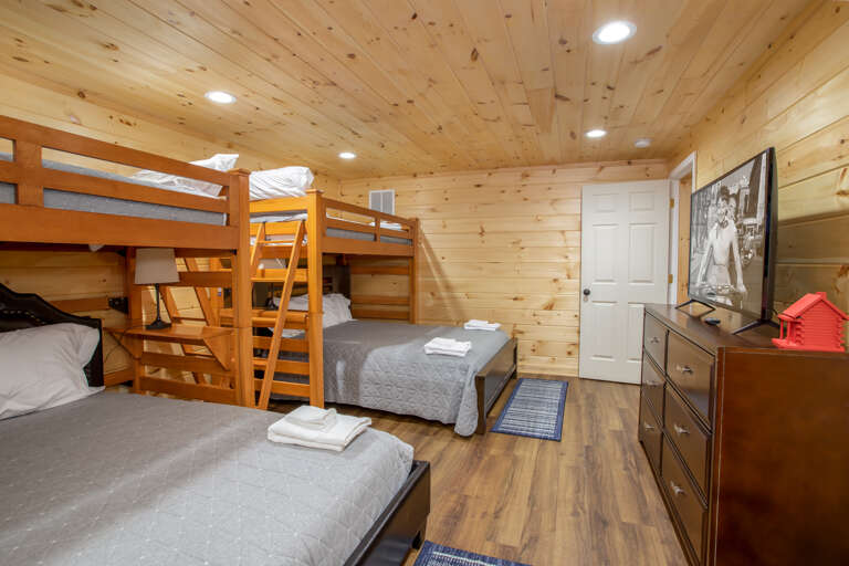 Lower level bunk room with 2 twin-over-queen beds (6 sleeping spots) and Smart TV Lower level bunk room with 2 twin-over-queen beds (6 sleeping spots) and Smart TV
