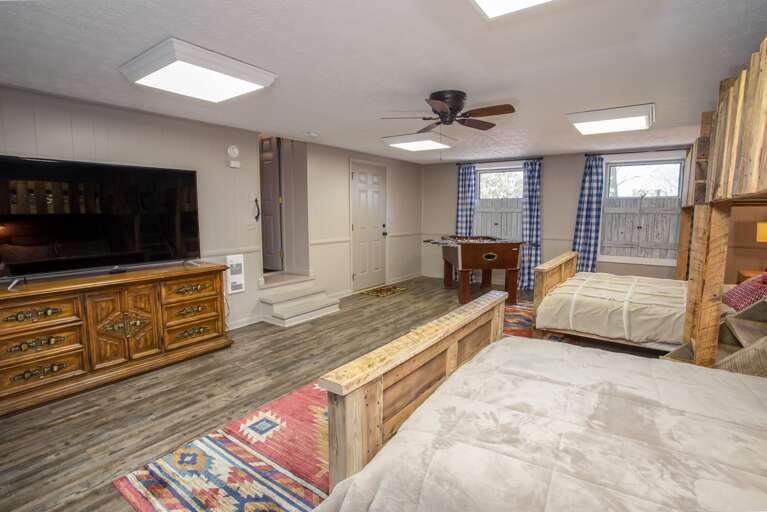 Fun Bunkroom with two twin over queens with foosball table and large TV Fun Bunkroom with two twin over queens with foosball table and large TV