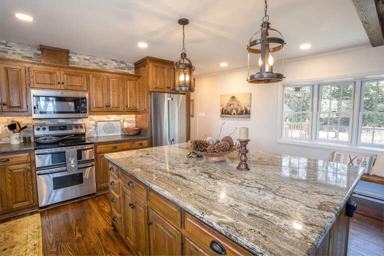Large Kitchen with Granite Countertops and Bartop Seating Large Kitchen with Granite Countertops and Bartop Seating