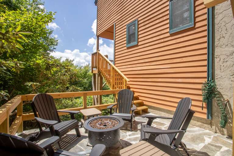 Fire Pit area on Stone Courtyard under Blue Skies with Mountain Views Fire Pit area on Stone Courtyard under Blue Skies with Mountain Views