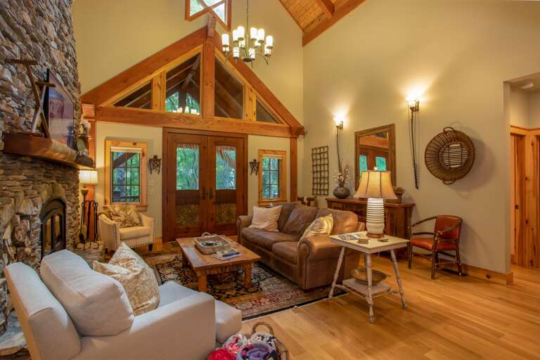 Great Room with Hardwood Floors and Vaulted Ceilings with Exposed Beams and Tongue-in-Groove!