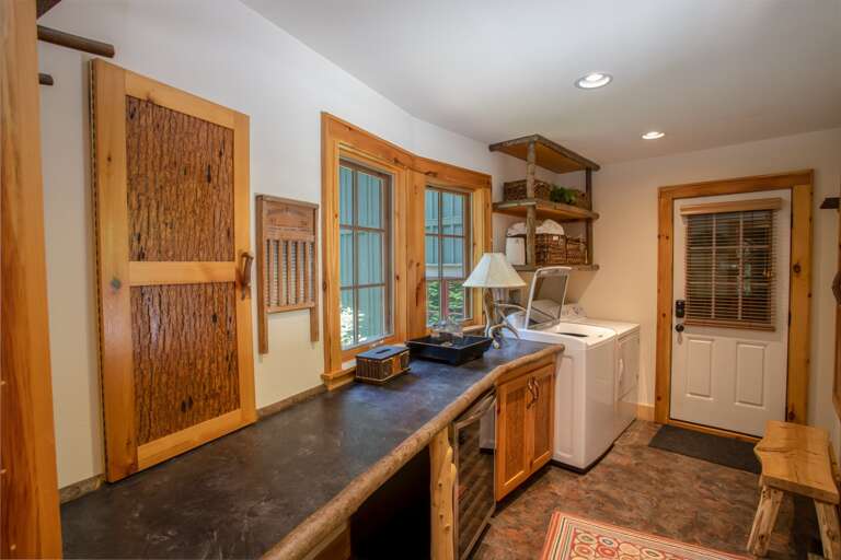 Laundry and Mud Room with Washer and Dryer, Wine Fridge, and Folding/Work Station